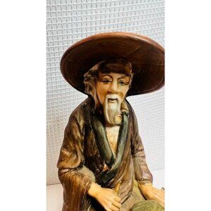 Vintage collectible figurine, old Asian wiseman holding a leaf fan, circa 1970